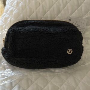 lululemon athletica Black Sherpa Bag with gold hardware